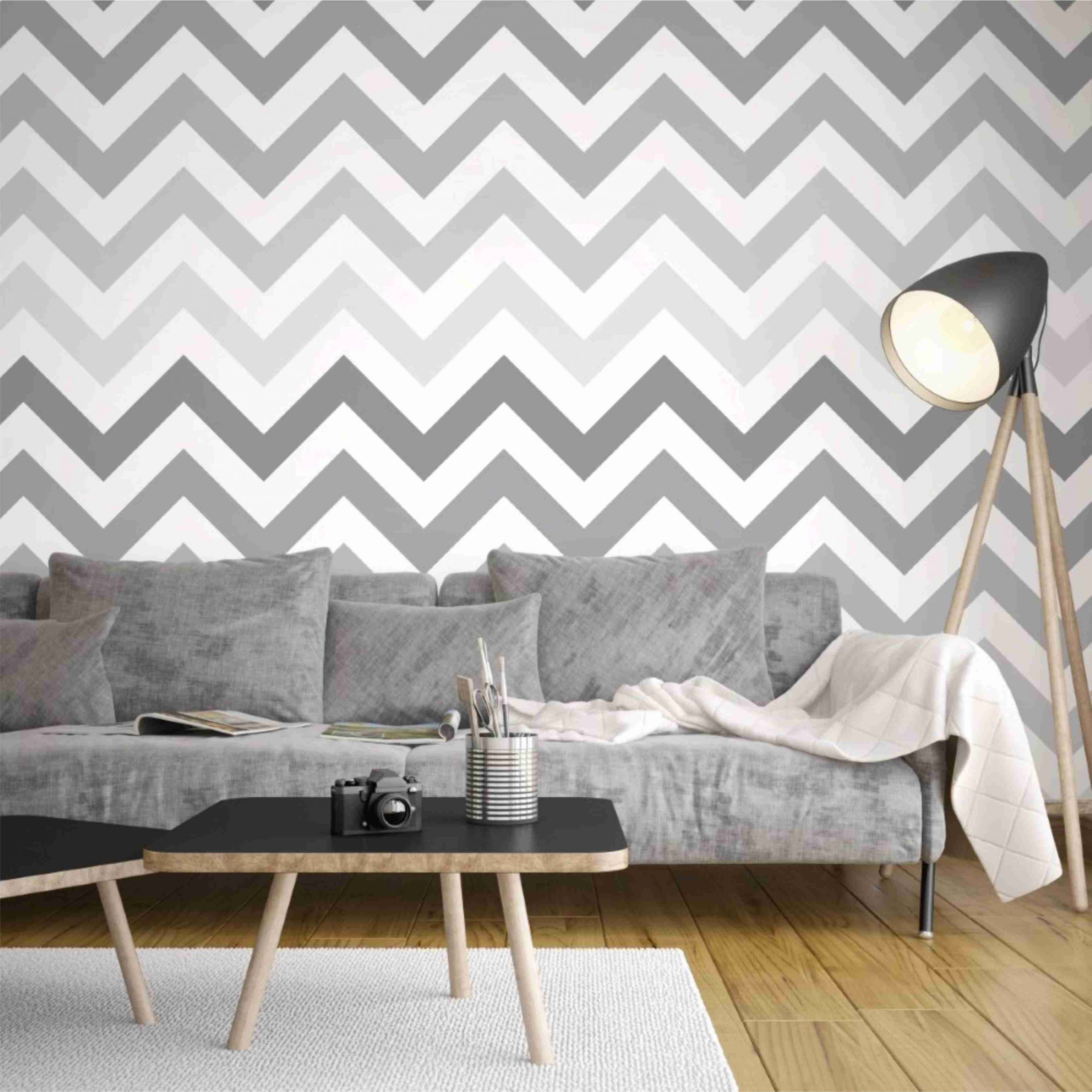 PAPEL DE PAREDE CHEVRON EM LISTRAS COM O FUNDO BRANCO E LISTRAS EM CINZA