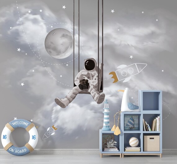PAPEL PAREDE ASTRONAUTA LUA E FOGUETE